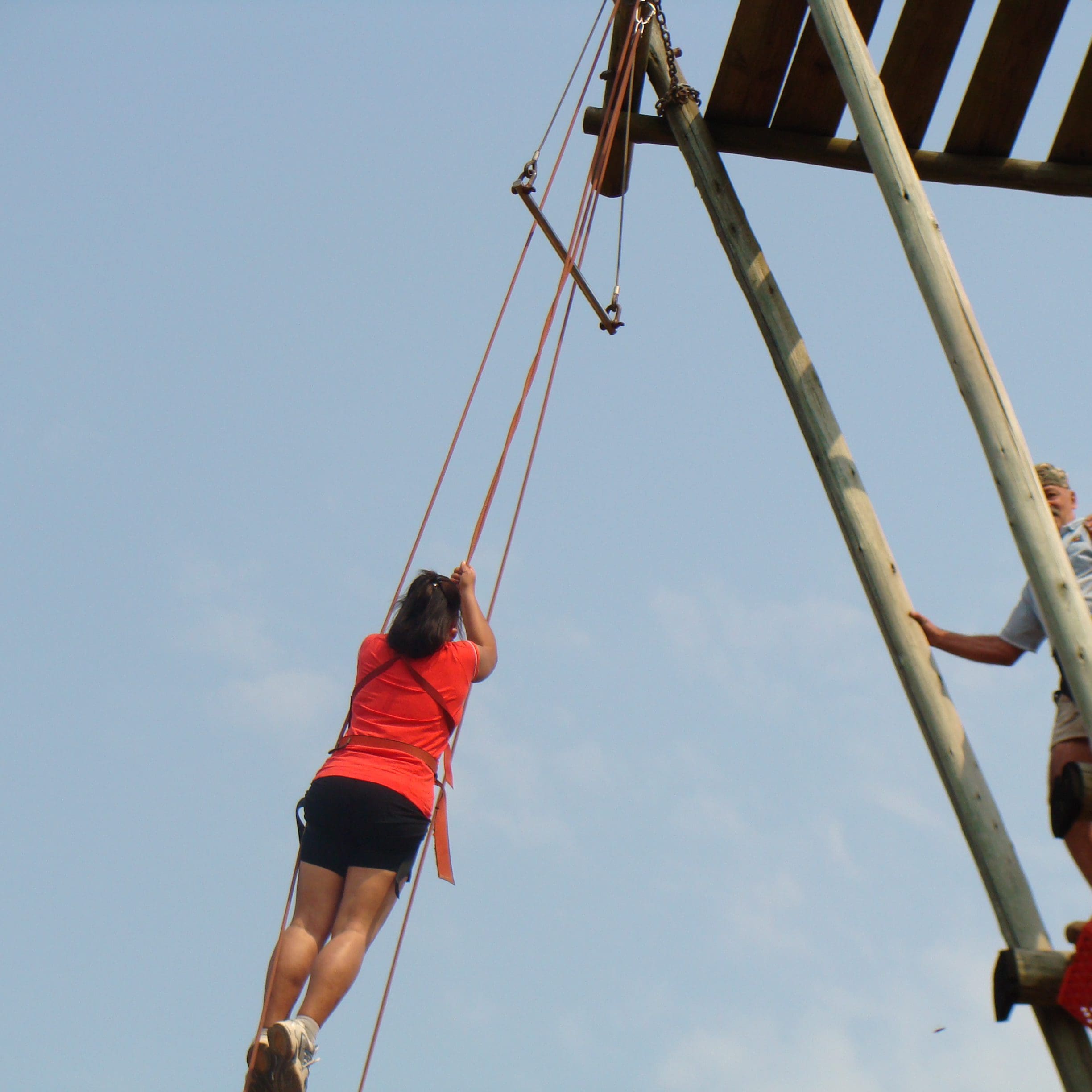 OLIVERS TRAVELS Woman hanging on harness